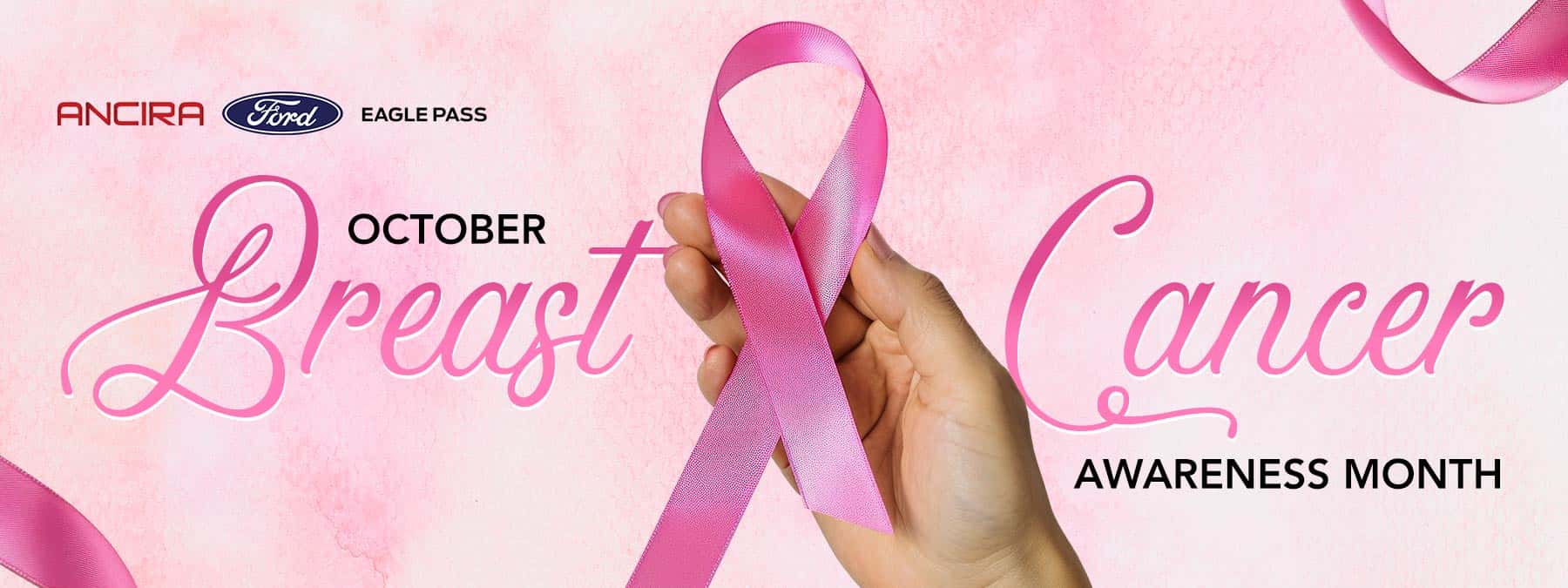 Pink Breast Cancer Awareness Month banner featuring a hand holding a pink awareness ribbon, with the Ancira logo and October Breast Cancer Awareness Month text on a soft pink background.
