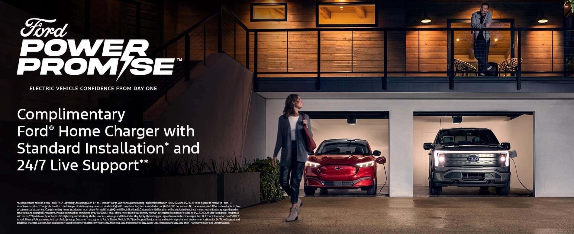 Lady in front of 2 Ford EVs in Garage