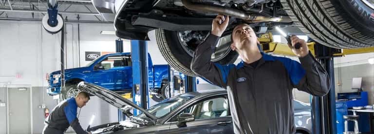 Ford technicians working in service bay at Biener Ford