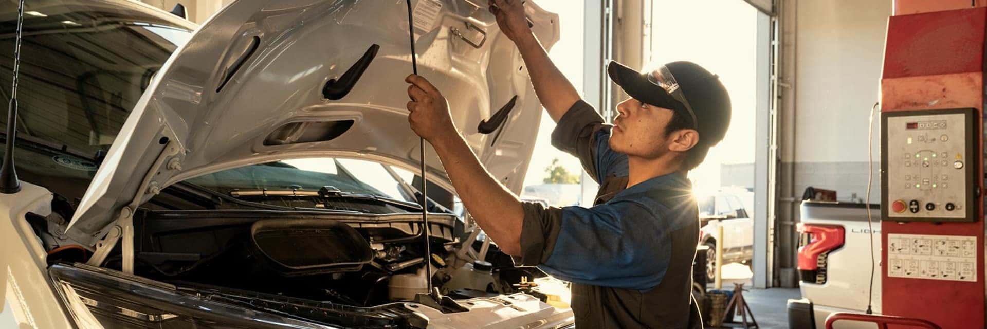ford technician inspecting vehicle