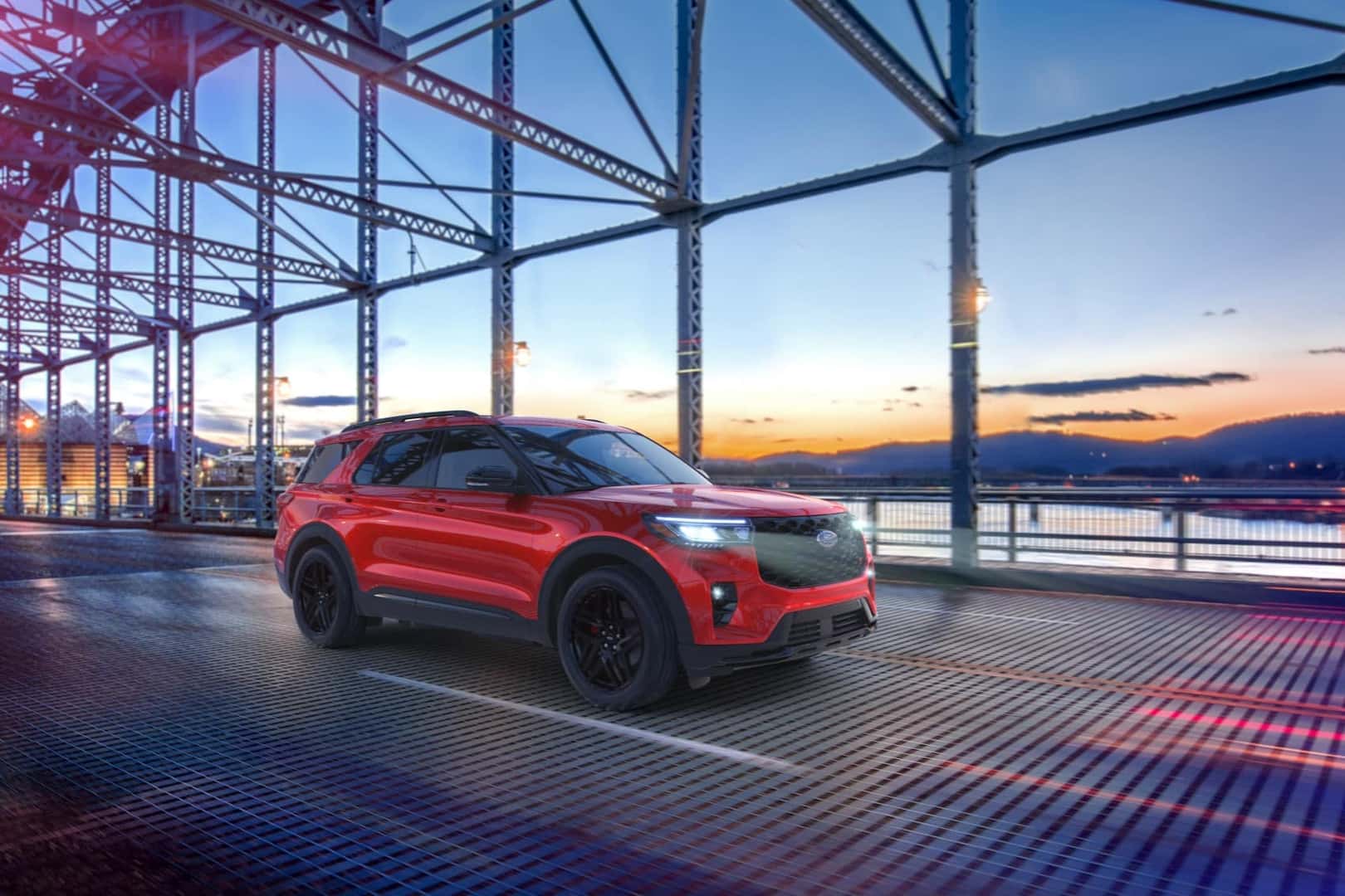 Red Ford Explorer crossing over bridge