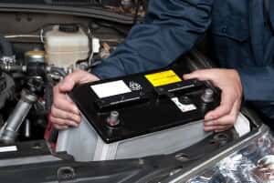 Person changing a car battery