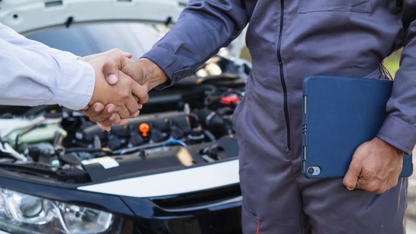 Customer vehicle being serviced with technician working efficiently