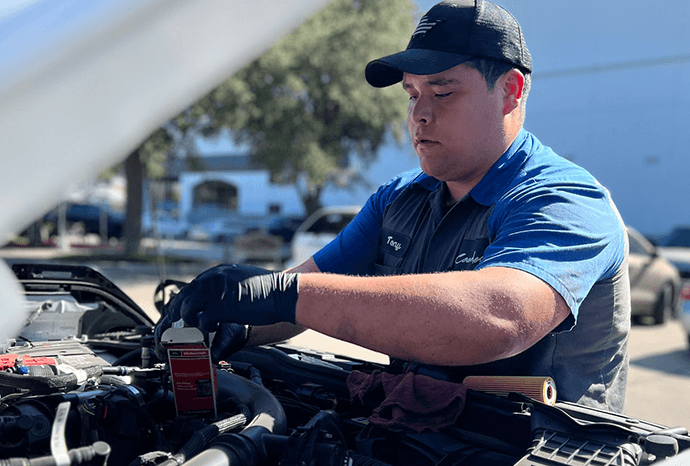 Grande Ford mobile service technician assisting a customer