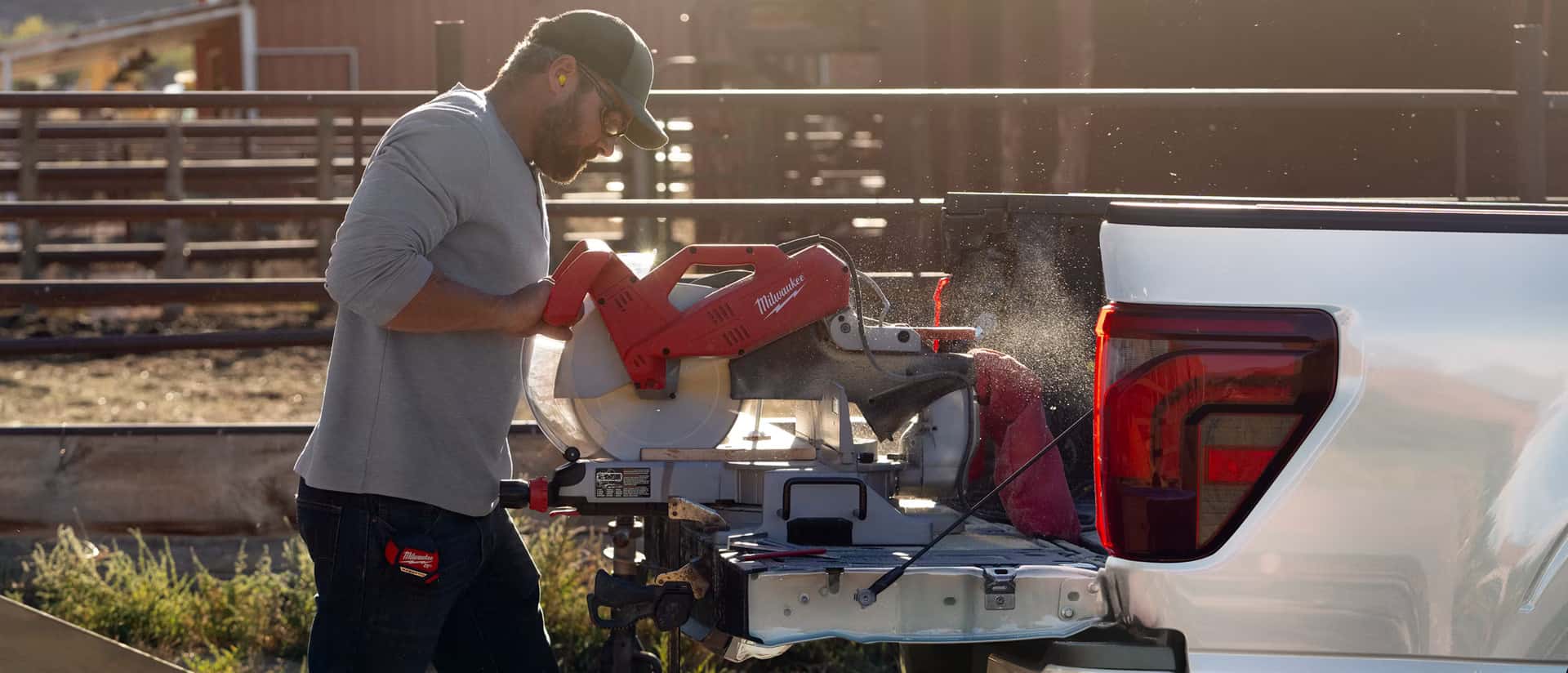 a man using the power plug in that is in the bed of the 2026 F-150