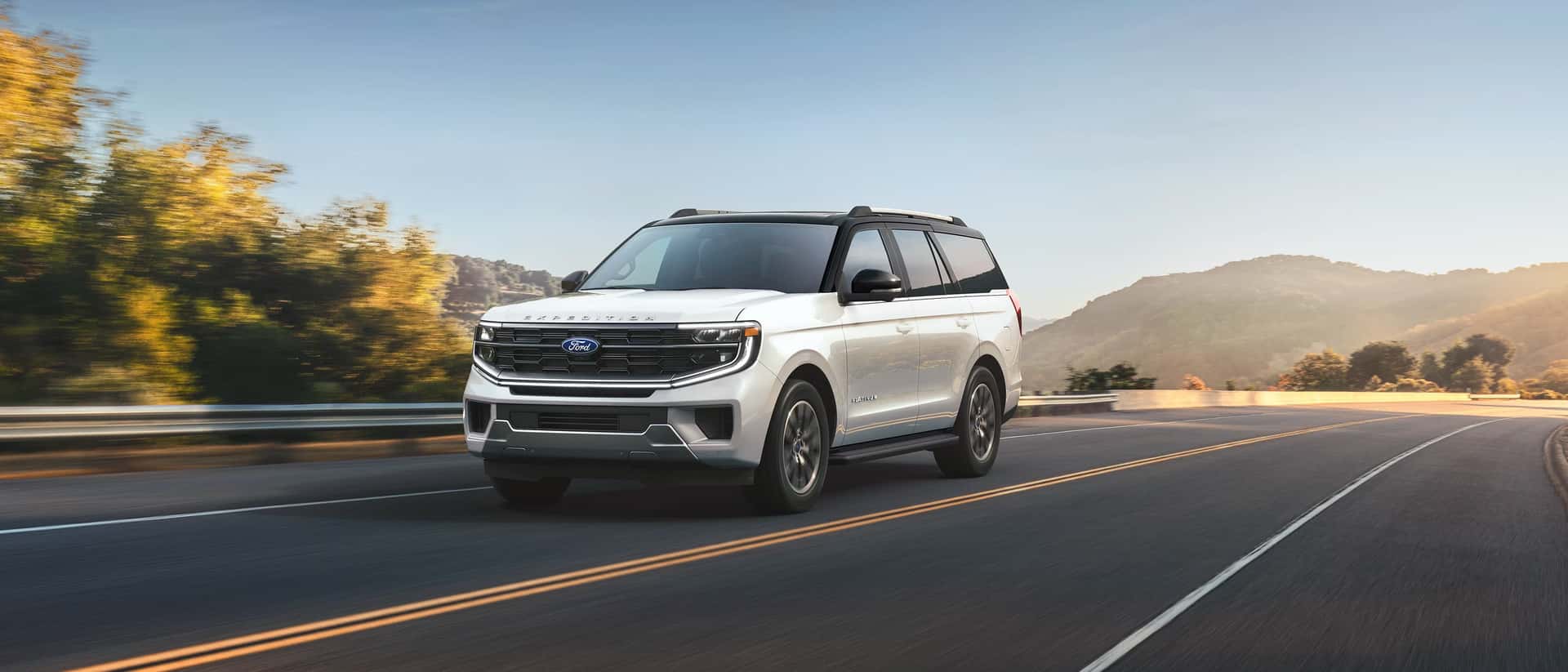 a 2026 Ford Expedition driving on a road