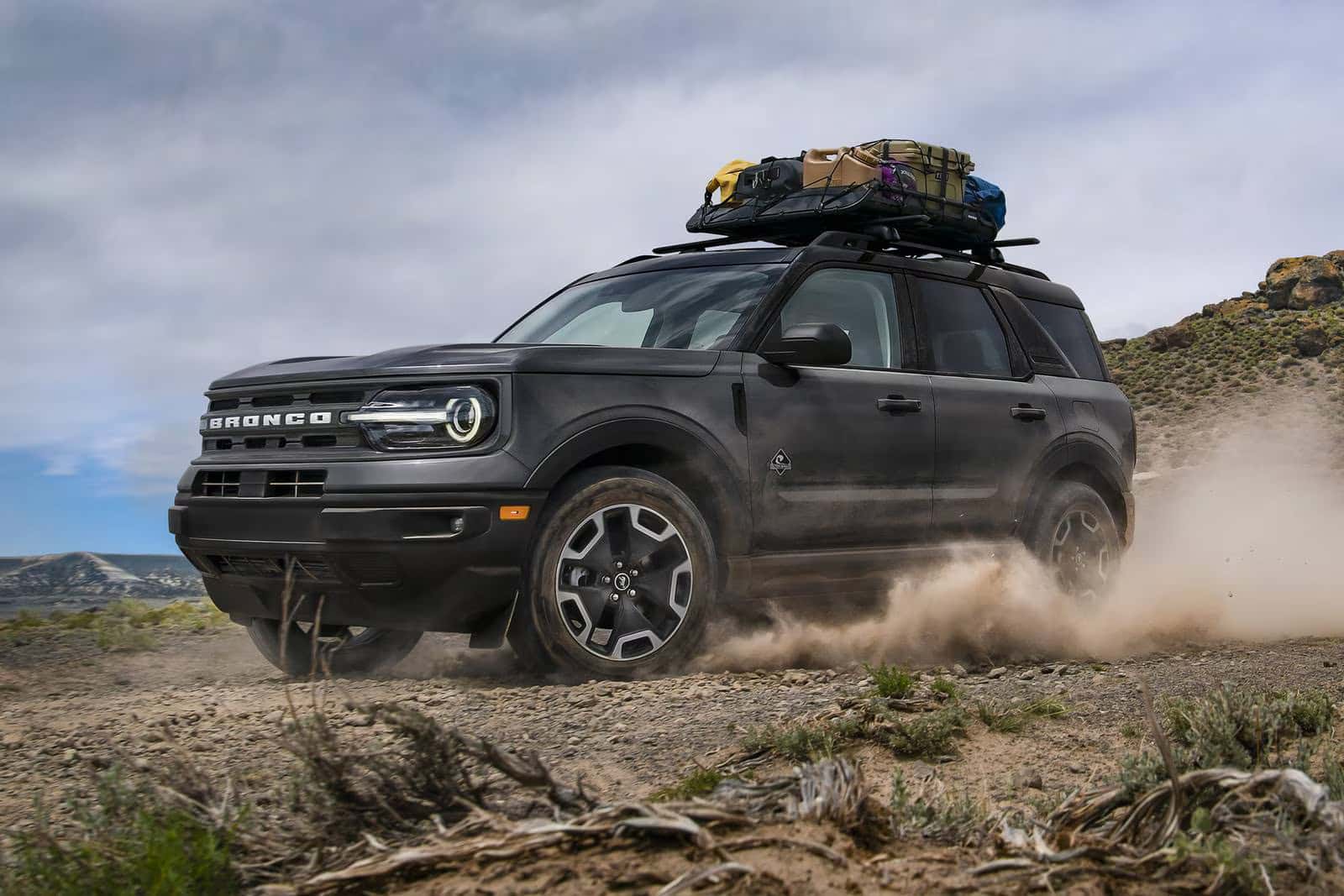 ford bronco sport driving in a rocky desert terrain