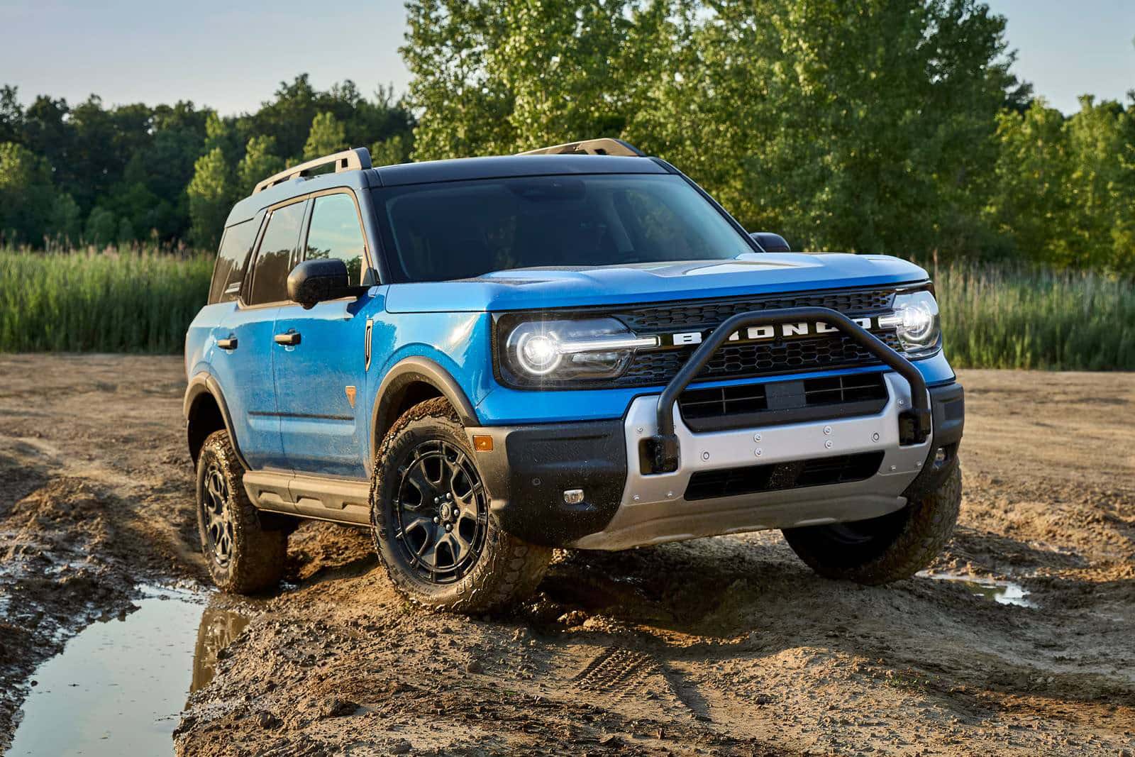 A new slightly head on look at the 2026 Ford Bronco Sport parked on a dirt path out in nature