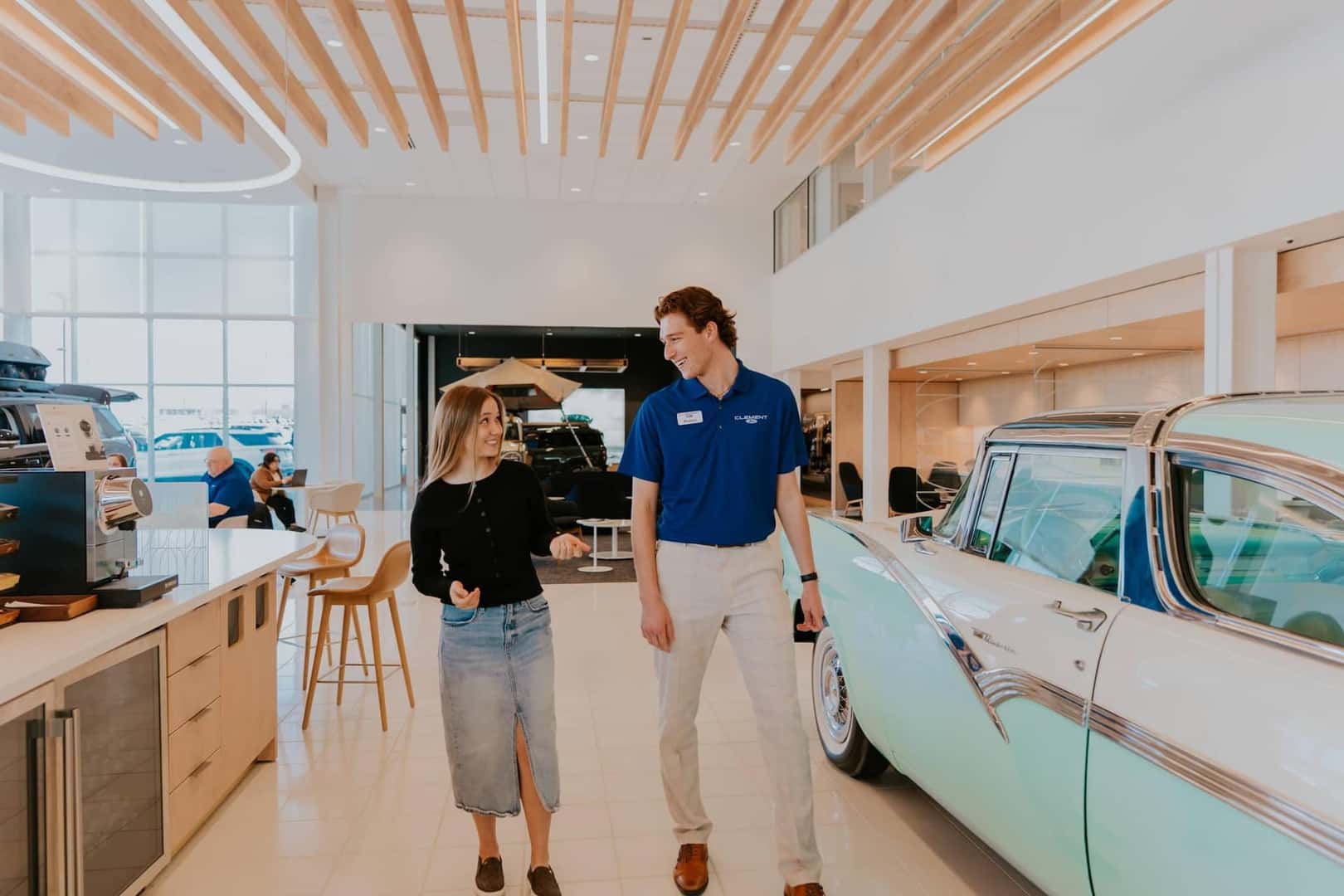 Shaking hands with a dealership sales representative for the purchase of a vehicle