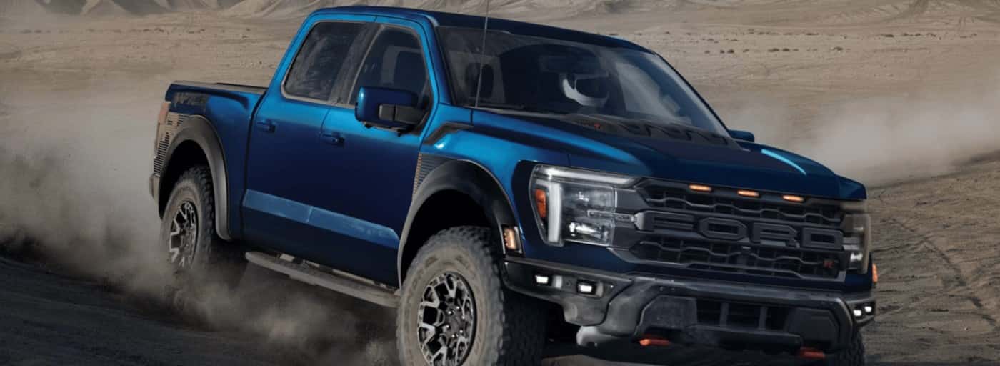 A blue 2026 Ford F-150 racing in desert