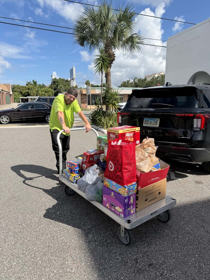 Cocoa Ford team member delivering donated food