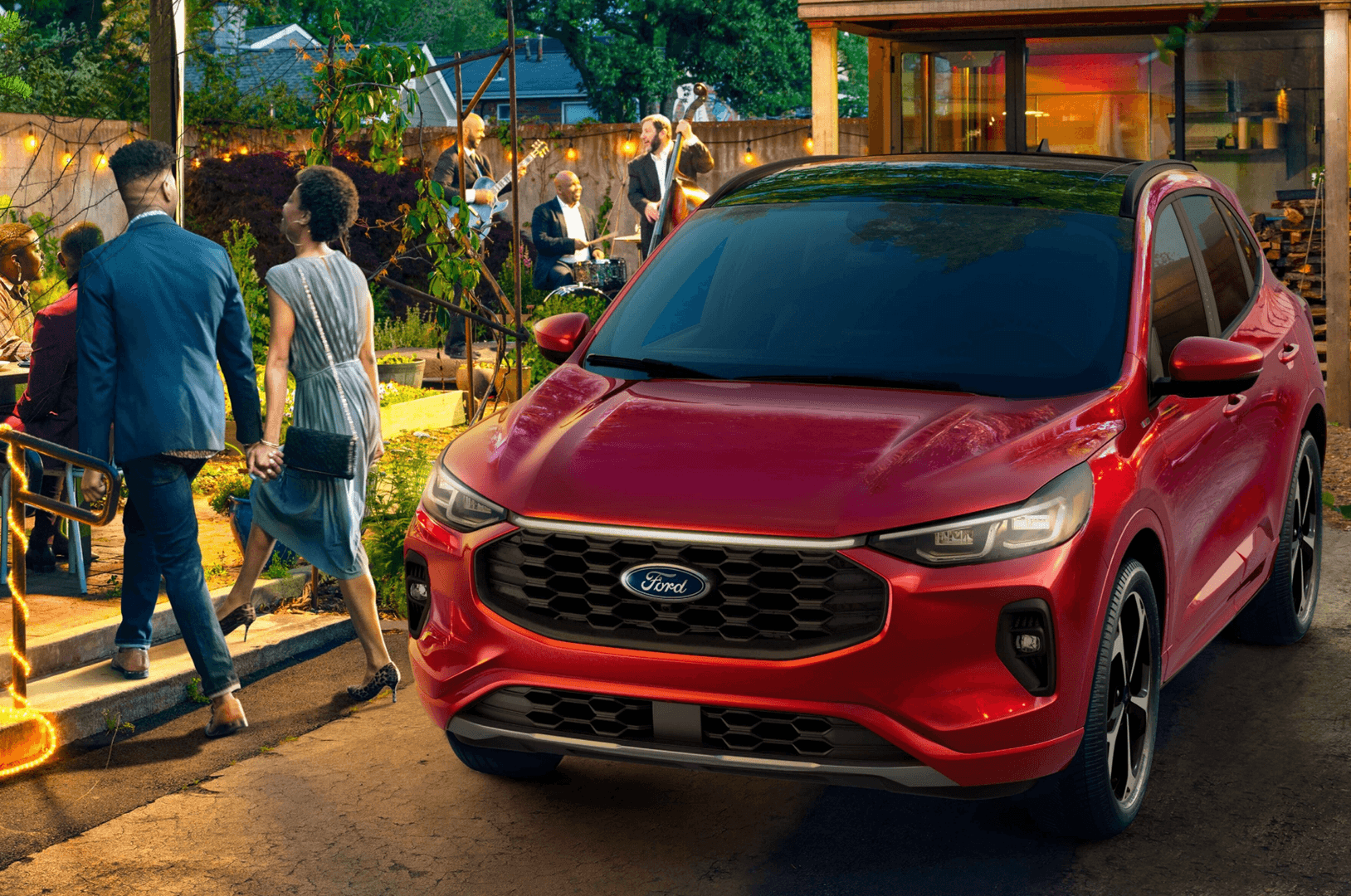 2025 red Ford Escape parked outside a lively outdoor event