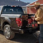 A farmer grabbing tools from his Ford F-150 work truck near Wichita