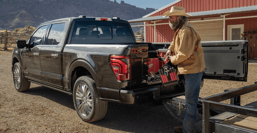 A farmer grabbing tools from his Ford F-150 work truck near Wichita