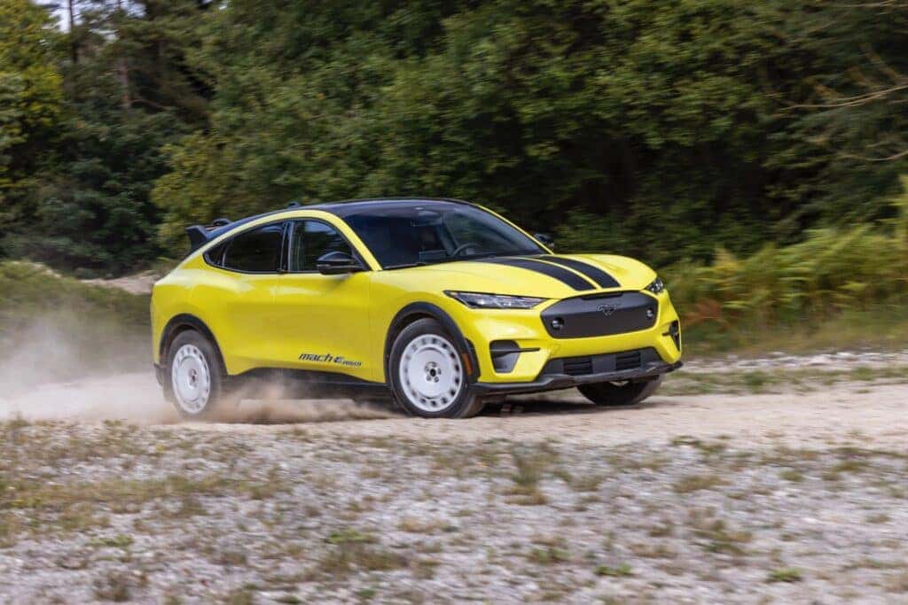 All Electric Ford Mustang Mach-E Rally, Blowing Dust As It Races Off-Road