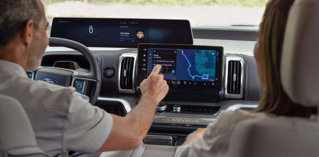 A 2025 Ford Expedition Driver Interacting With The Advanced Infotainment Screen
