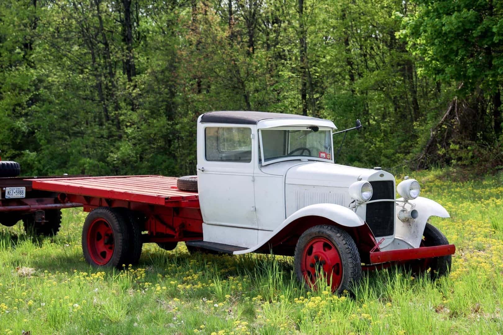 The Magnificent 1931 Ford Model AA, Trekking Through A Grassy Meadow Surrounded By Trees