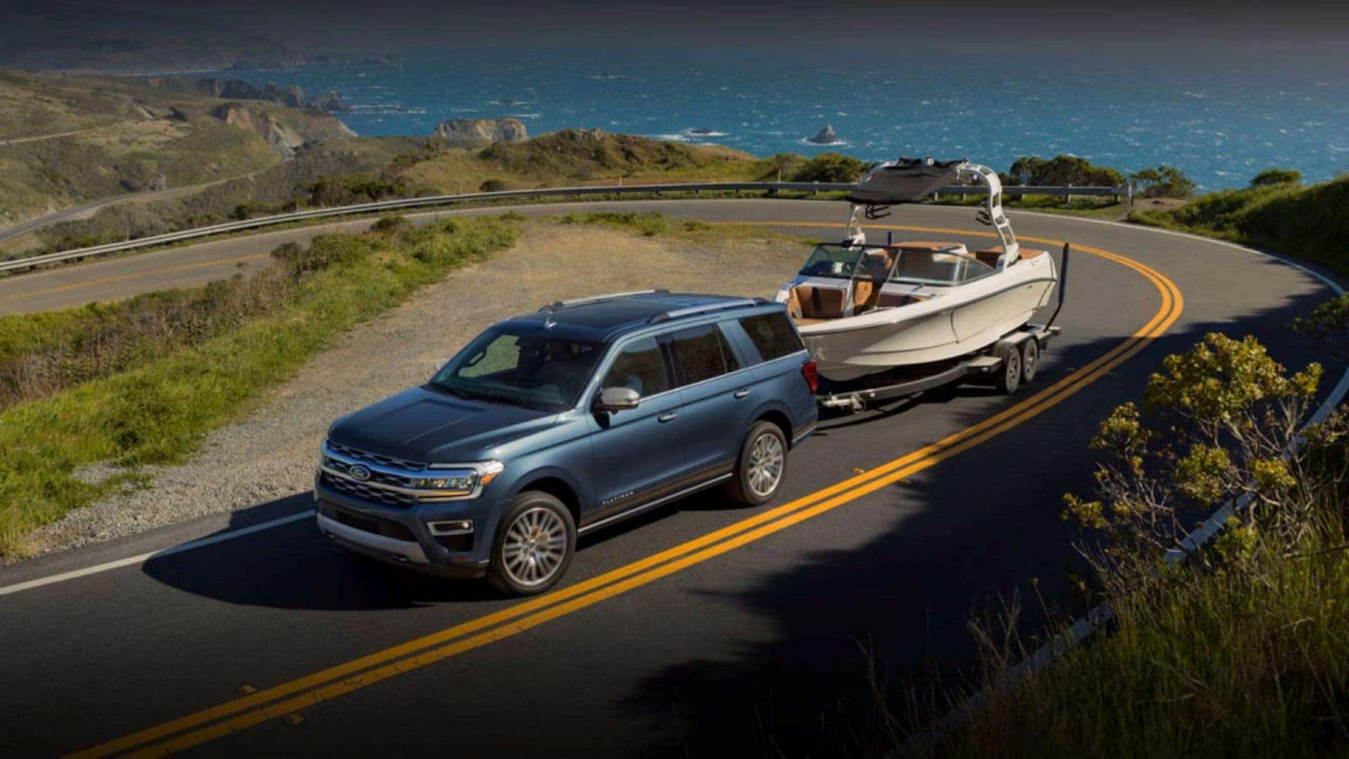 A Ford Truck Safely And Confidently Towing A Boat
