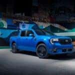 A Beautiful Blue 2025 Ford Maverick Lobo Parked In Front Of A Gorgeous Mural