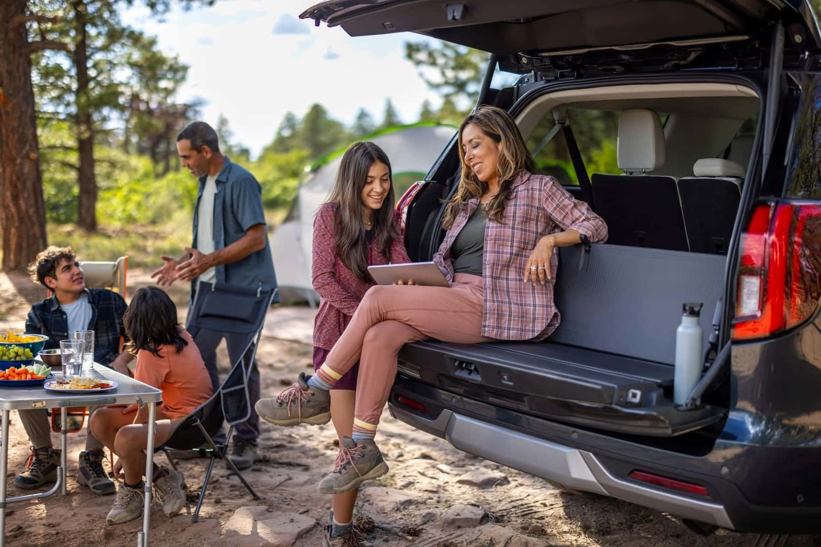 A Family Enjoying Their Ford Expedition During Their Camping Trip