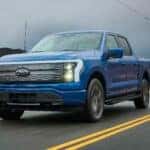 2022 Ford F-150 Lightning Driving down a road