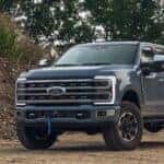 2023 Ford F-250 Super Duty parked by a dirt hill