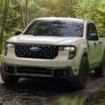 2025 Ford Maverick driving through the woods