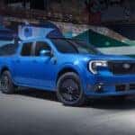 2025 Ford Maverick Lobo parked in front of a colorful wall