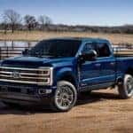 blue 2025 Ford F-Series Super Duty Platinum on a farm