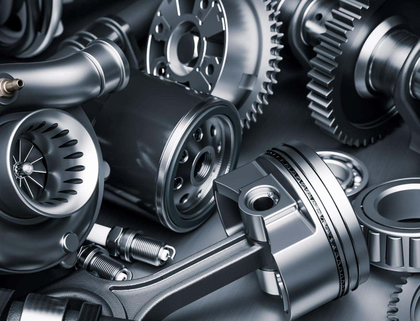 A collection of automotive engine components, including gears, a piston, bearings, spark plugs, a turbocharger, and an oil filter, arranged together to represent vehicle parts.