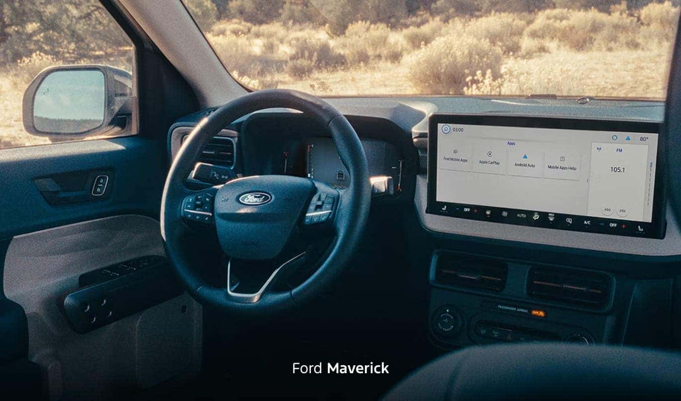 Ford Maverick interior featuring a multifunction steering wheel, digital instrument cluster, and large center touchscreen.