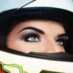 Close-up portrait of beautiful woman with stylish makeup in biker helmet