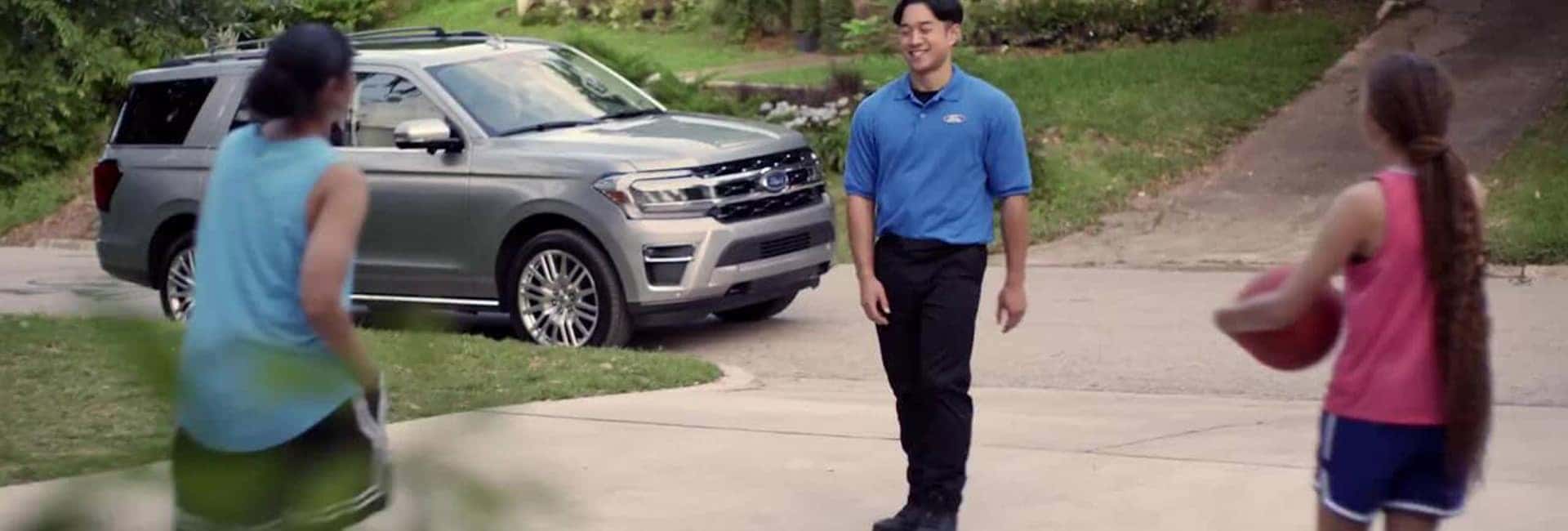 Fill back ford employee picking up a customer's vehicle