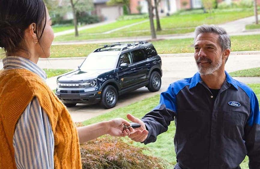 male technician grabbing keys from customer
