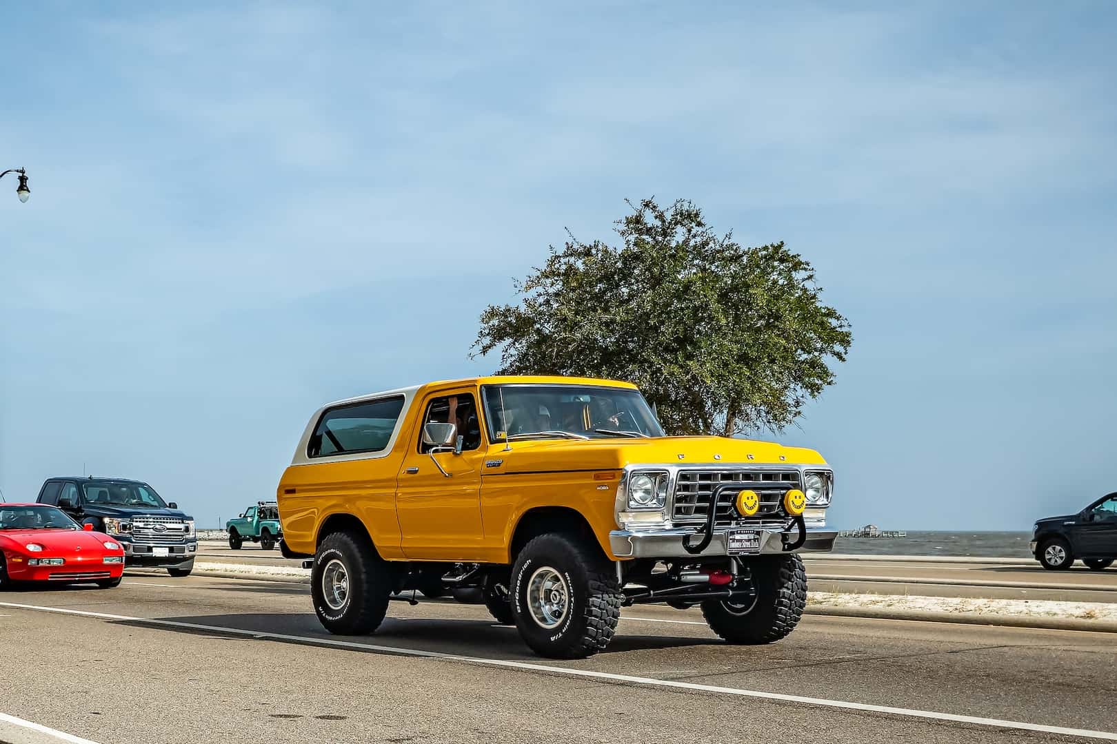 Wide angle front corner view of a 1978 Ford Bronco Custom SUV Wagon at a local car show.
