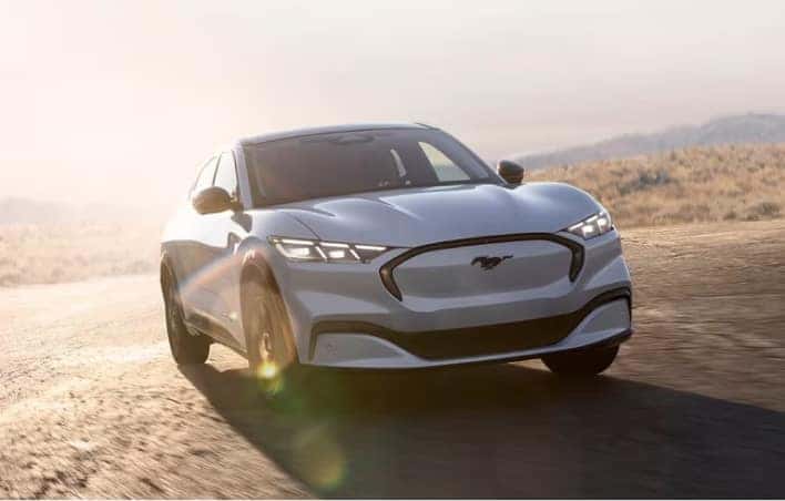 Ford Sedan driving on the desert