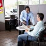 Fillback Ford salesperson helping a customer