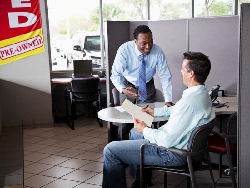 Fillback Ford salesperson helping a customer