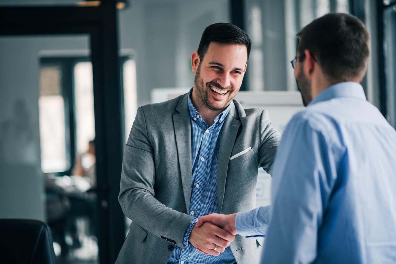 Ford Finance Team member shaking hands with customer in California before discussing financing options