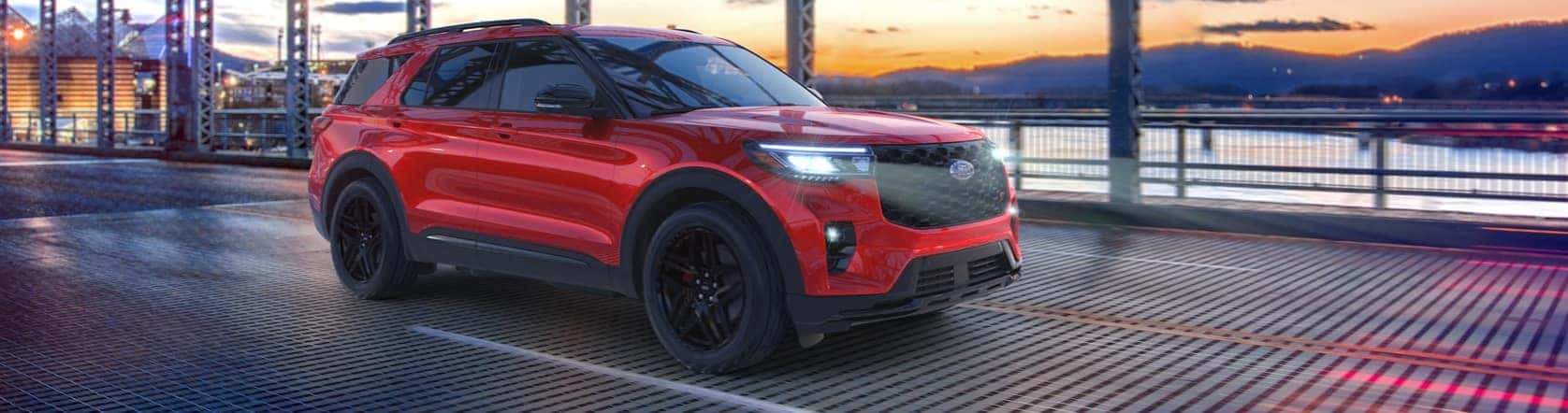 Ford Explorer driving over a bridge during sunset