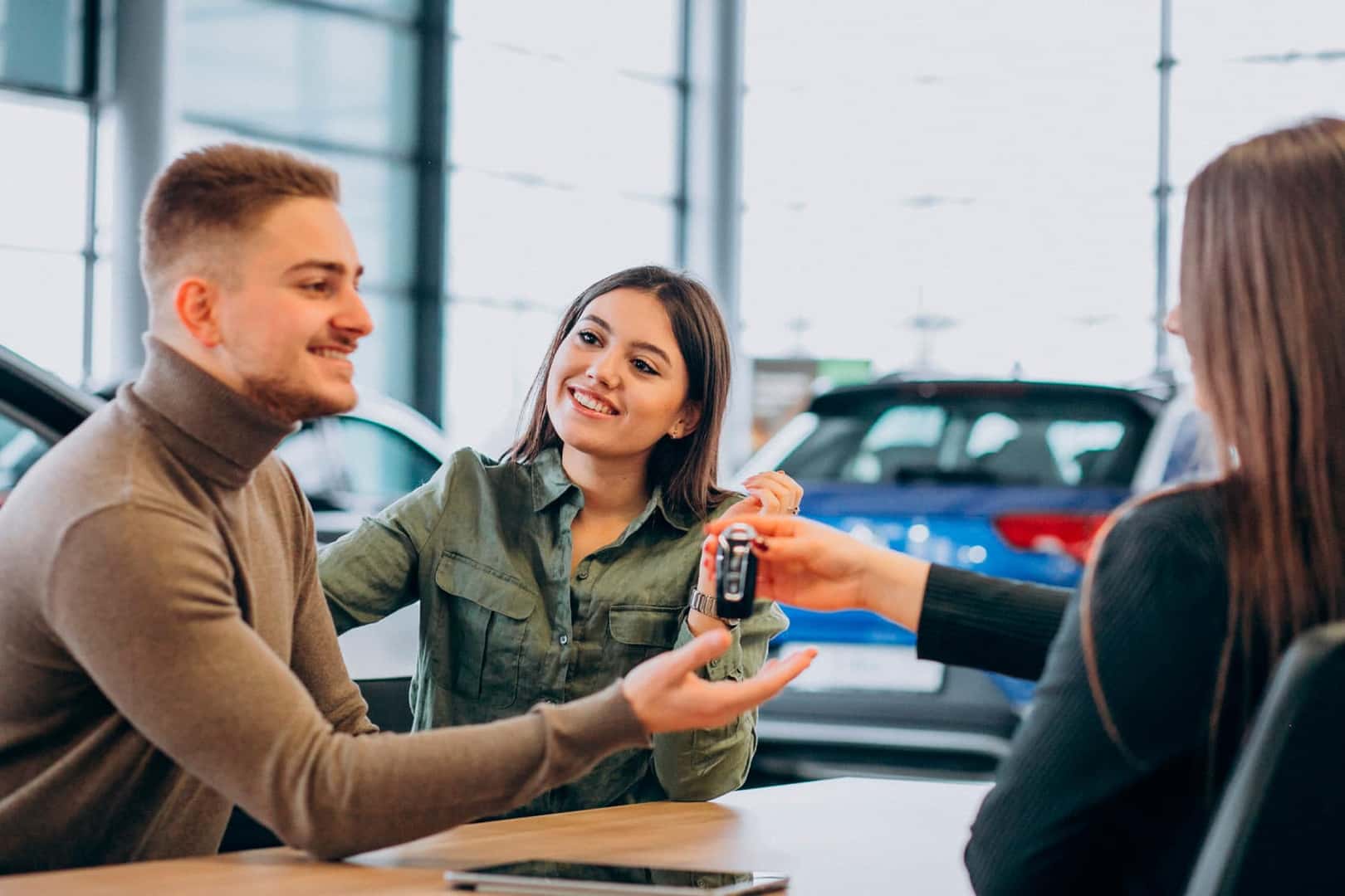 Couple speaking with finance team at Upland of Ford - Ford Bronco Lease Deals near Upland CA