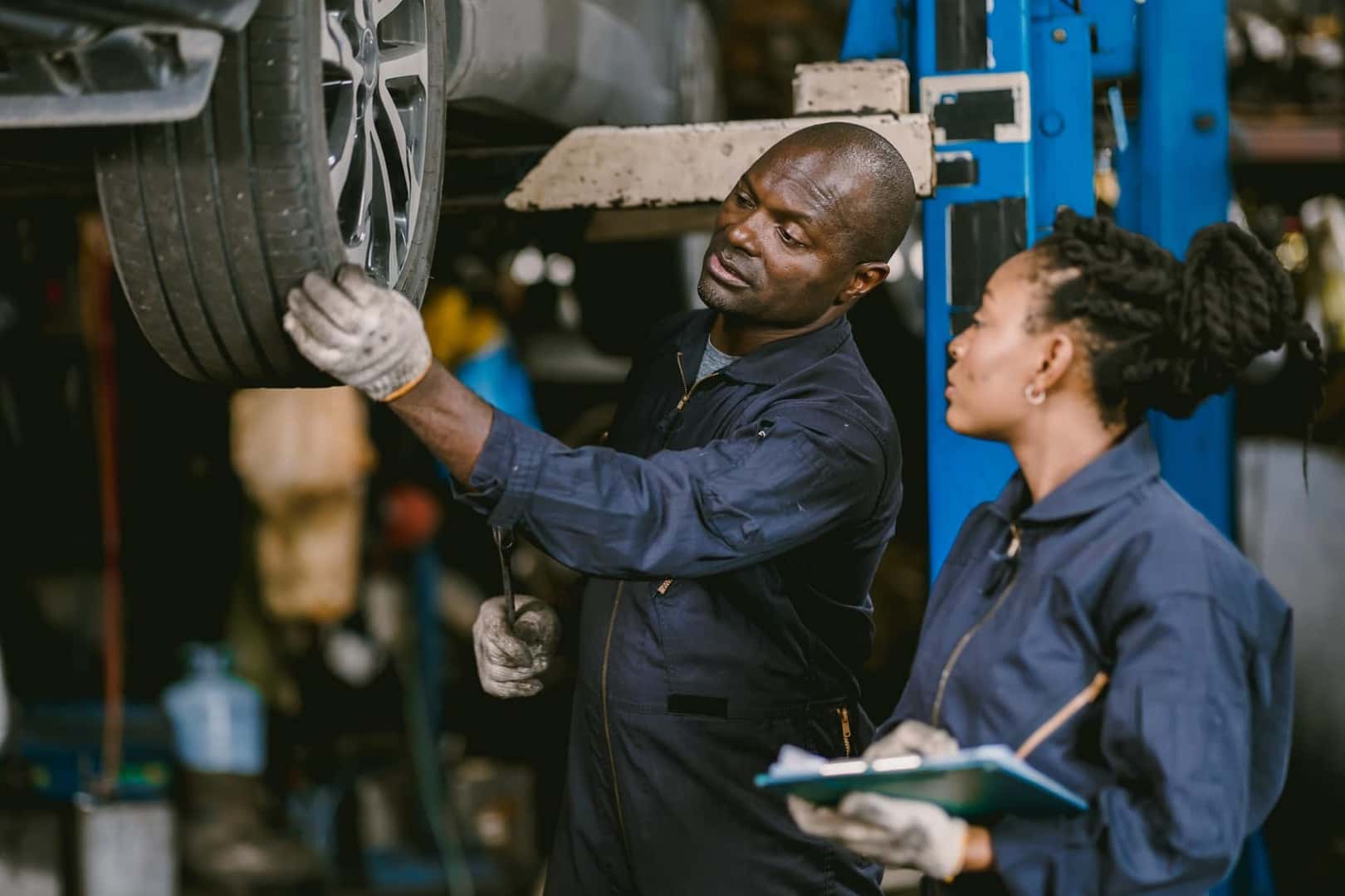 Ford Certified Technicians inspecting tires at Service Center