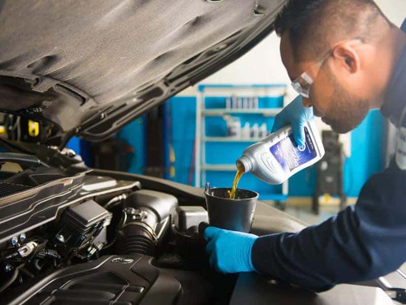 Ford Certified Technician performing an Oil Change near Me