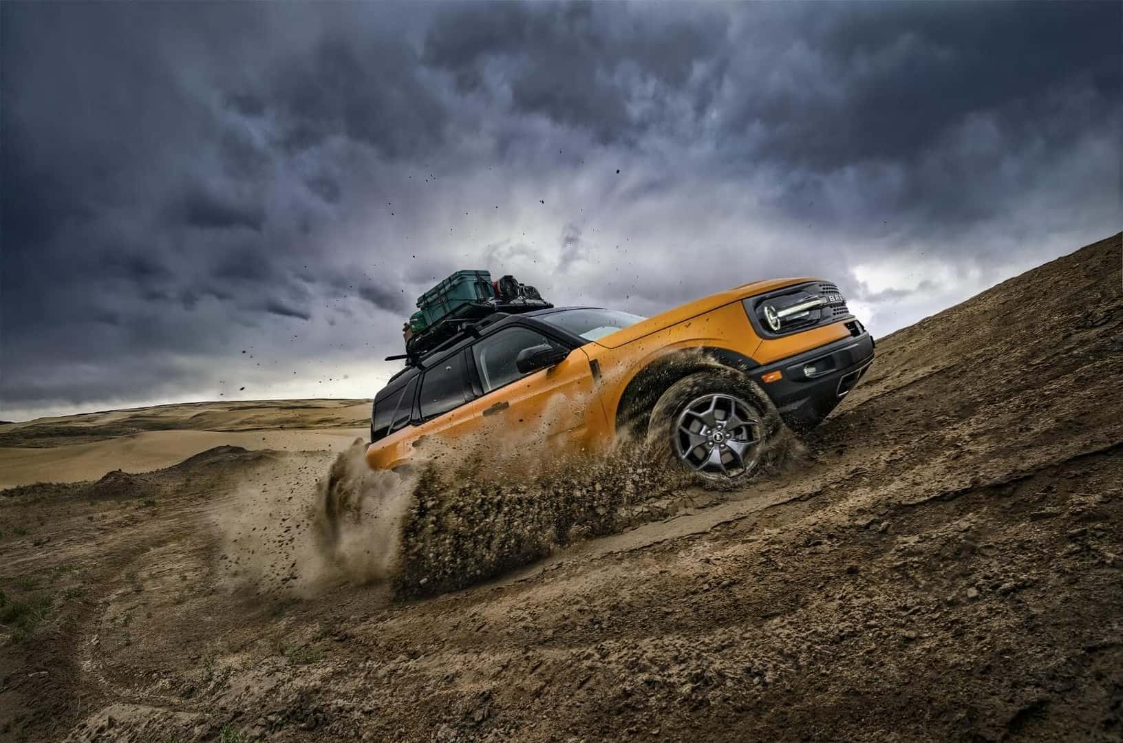 Ford Bronco Sport driving on dirt road kicking up dirt from Used Car Dealer near Rancho Cucamonga CA