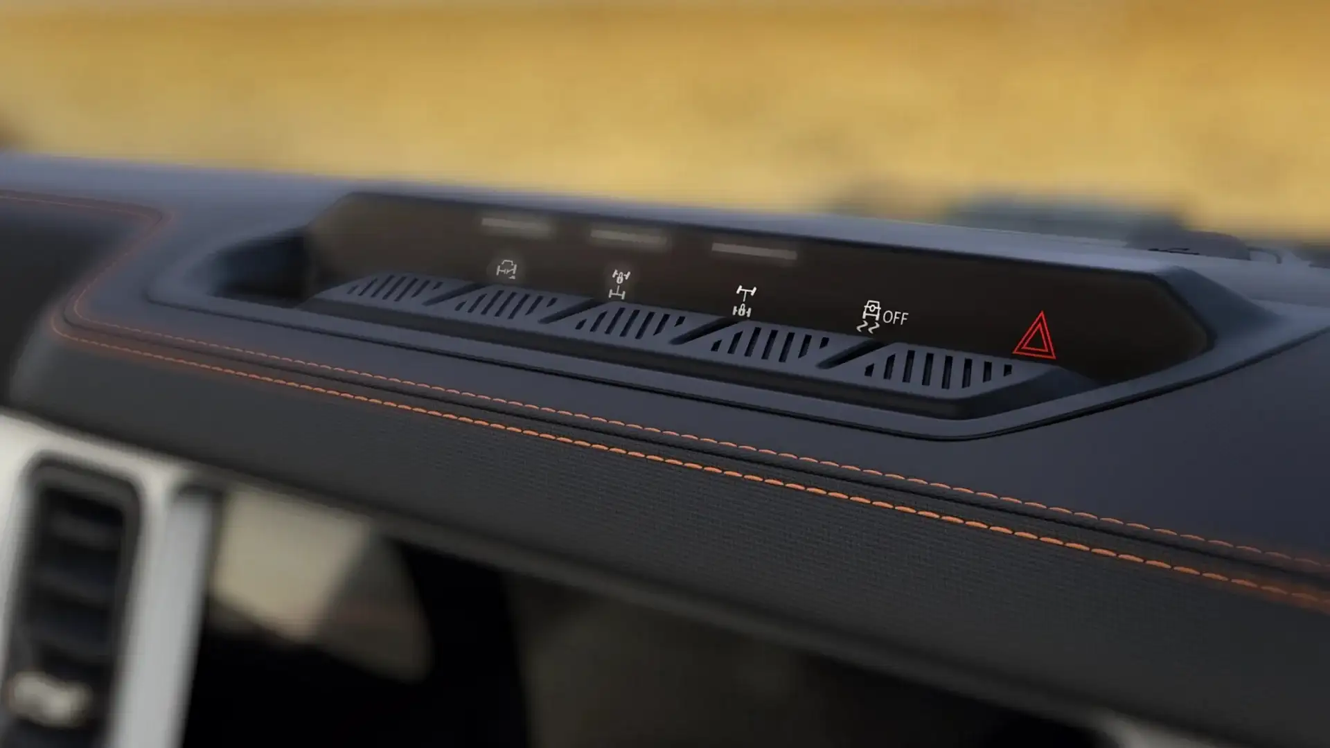Top view of the 2025 Ford Bronco® dashboard controls with terrain management and traction assist buttons.
