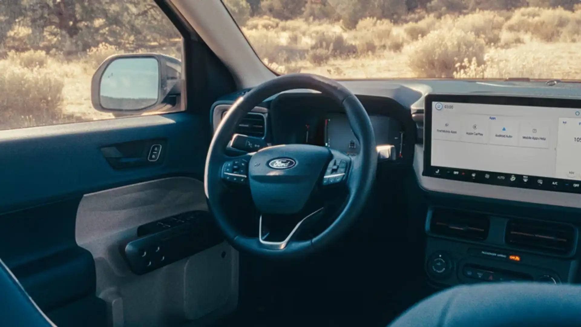 2026 Ford Maverick® interior dashboard view with steering wheel and touchscreen display.