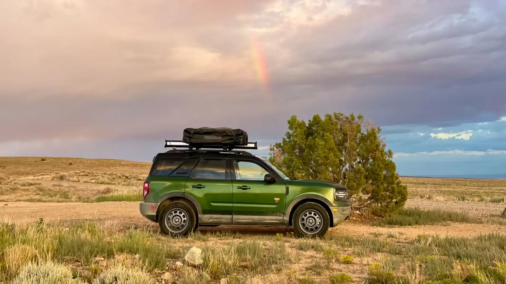 2025 Ford Bronco Sport® in a rugged outdoor setting, displaying its off-road capabilities with a rooftop cargo box.