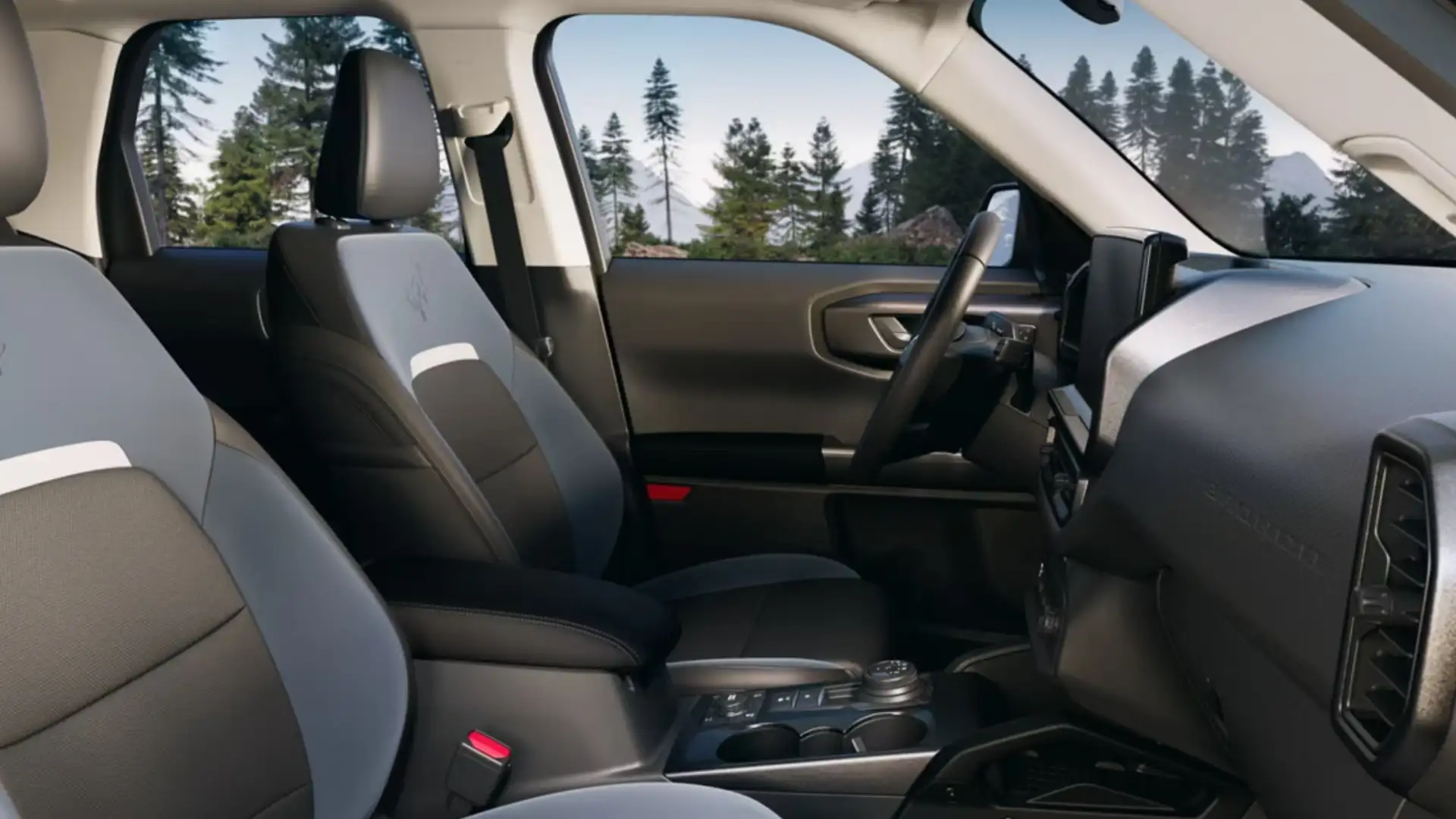 2025 Ford Bronco Sport® interior with black and gray leather seating, modern dashboard, and off-road-ready controls.