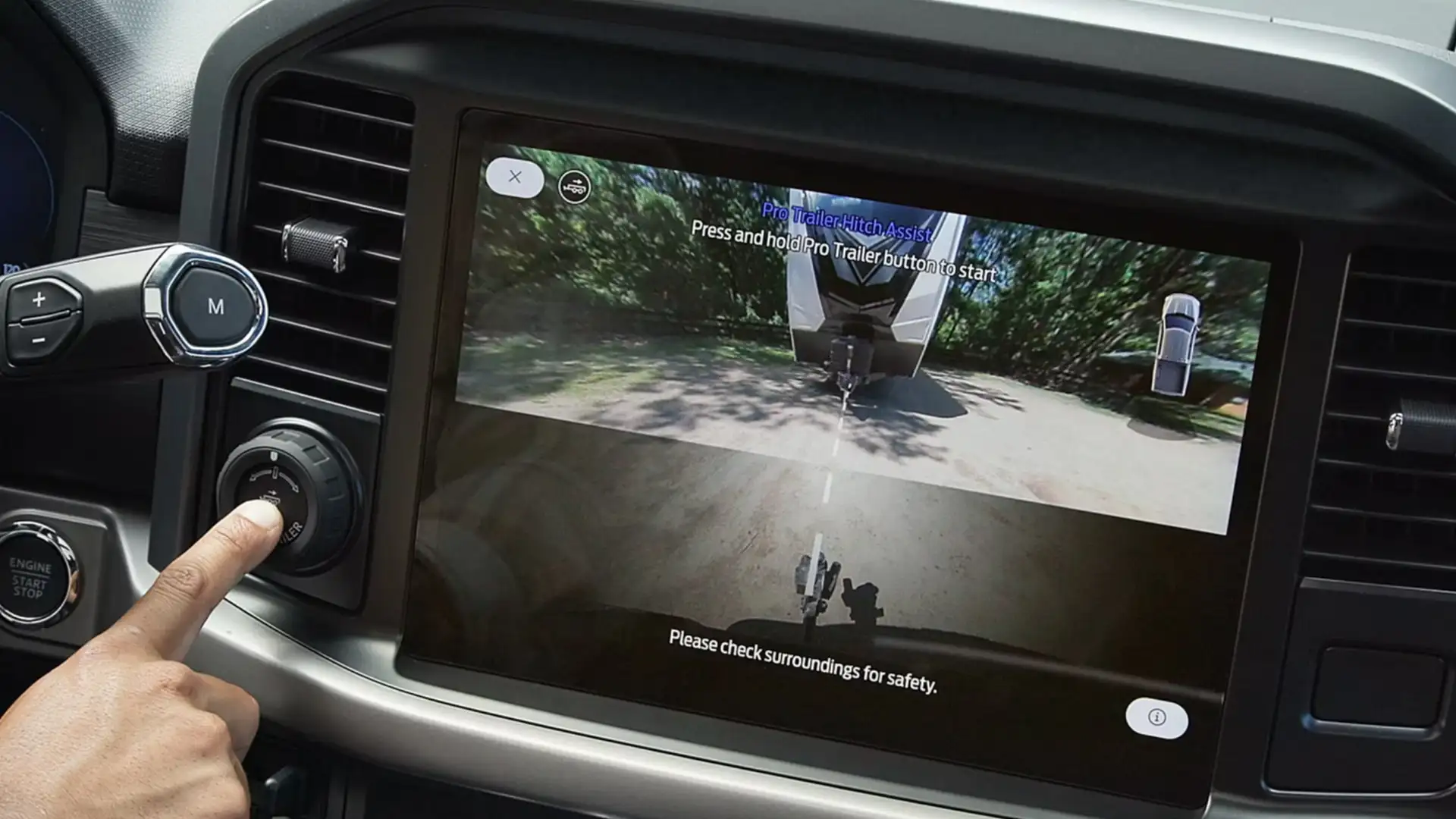2025 Ford F-150® cabin featuring touch-screen with Pro Trailer Hitch Assist, highlighting trailer connectivity for easy towing.