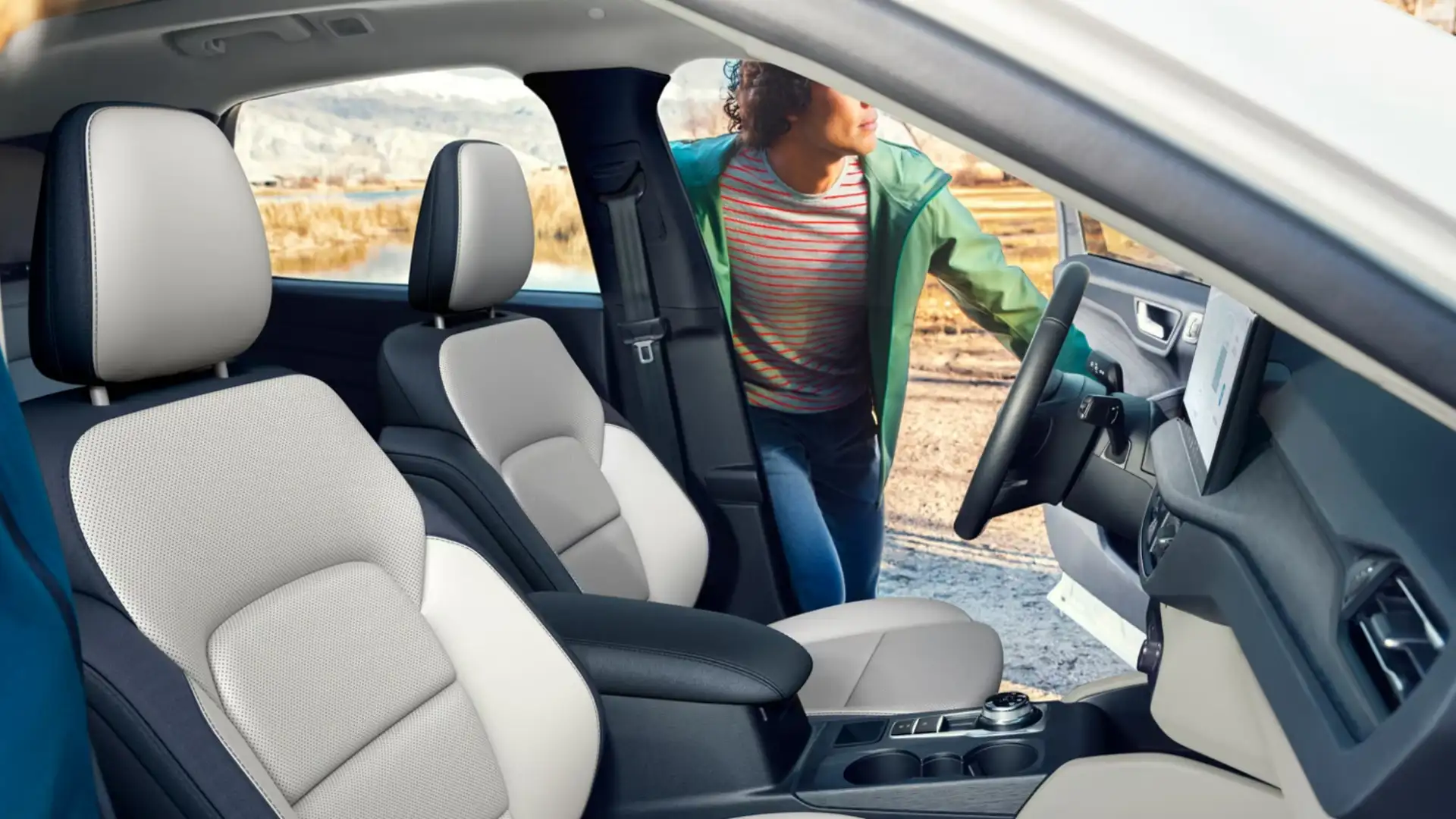 2026 Ford Escape® interior featuring comfortable seating with light and dark color accents, designed for outdoor adventures.
